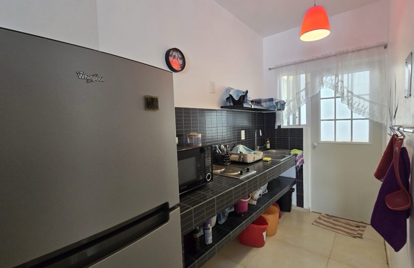 Ground Floor Condo for Sale in Alquería | Turnkey 1BR + Studio with Patio